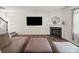 Inviting living room features a fireplace, neutral palette, and wood flooring at 404 Saddlebred Ln, Locust, NC 28097