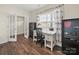 Bright office featuring wood floors, a window, and a modern desk at 404 Saddlebred Ln, Locust, NC 28097