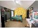 Upstairs bedroom with green bedding and yellow accent wall at 4205 Springhaven Dr, Charlotte, NC 28269