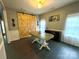 Inviting dining room featuring a wooden table, neutral walls, and view to kitchen at 4205 Springhaven Dr, Charlotte, NC 28269