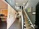 Welcoming foyer with a staircase, modern sliding barn door, and neutral color palette at 4205 Springhaven Dr, Charlotte, NC 28269