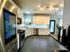 Renovated kitchen featuring stainless steel appliances, white cabinets, tile backsplash, and modern fixtures at 4205 Springhaven Dr, Charlotte, NC 28269
