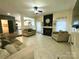 Cozy living room with stylish seating, fireplace, and view to the kitchen at 4205 Springhaven Dr, Charlotte, NC 28269