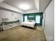 Spacious primary bedroom featuring a trey ceiling, ensuite bathroom, and neutral paint palette at 4205 Springhaven Dr, Charlotte, NC 28269