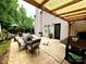Lovely outdoor patio with ample seating, grill, privacy, and shade at 4205 Springhaven Dr, Charlotte, NC 28269