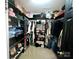 Walk-in closet with custom shelving, clothing racks, and ample storage space at 4205 Springhaven Dr, Charlotte, NC 28269