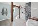 A beautifully tiled shower with a rain-style showerhead is featured in the bathroom at 4615 Lockhart Rd, Sharon, SC 29742