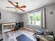 A versatile bonus room with natural lighting, ceiling fan, and wood look flooring at 4615 Lockhart Rd, Sharon, SC 29742
