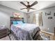 Cozy bedroom with a comfortable bed, ceiling fan, and natural light from the window at 4615 Lockhart Rd, Sharon, SC 29742