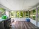 Sunroom converted to laundry room boasts ample natural light and wood look flooring at 4615 Lockhart Rd, Sharon, SC 29742