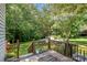 Wood back deck overlooking expansive backyard with lush green trees at 4919 Rehobeth Rd, Waxhaw, NC 28173