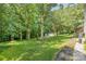 Expansive backyard with lush green grass and mature trees at 4919 Rehobeth Rd, Waxhaw, NC 28173