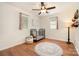 Bright bedroom features wood floors, ceiling fan, two windows, and a black metal baby crib at 4919 Rehobeth Rd, Waxhaw, NC 28173