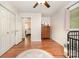 Bright bedroom with wood floors and neutral walls has closet and dresser at 4919 Rehobeth Rd, Waxhaw, NC 28173