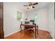 Bedroom with hardwood floors, neutral walls, and abundant natural light at 4919 Rehobeth Rd, Waxhaw, NC 28173