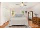 Bedroom with hardwood floors, light pink walls, and lots of natural light at 4919 Rehobeth Rd, Waxhaw, NC 28173
