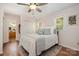 Bedroom with hardwood floors, light pink walls, and closet at 4919 Rehobeth Rd, Waxhaw, NC 28173