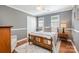 Bedroom features wood floors, neutral walls, closet, and ceiling fan at 4919 Rehobeth Rd, Waxhaw, NC 28173