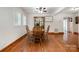 Bright dining area with hardwood floors, a wooden table, and ample natural light at 4919 Rehobeth Rd, Waxhaw, NC 28173