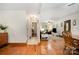 View of the hardwood floors dining area, showing connection to the hallway and the living room at 4919 Rehobeth Rd, Waxhaw, NC 28173