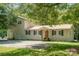 Charming two-story home with a metal roof, black shutters, and mature trees offering plenty of shade at 4919 Rehobeth Rd, Waxhaw, NC 28173