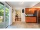 Bright kitchen features stainless steel appliances, access to the deck, and tile flooring at 4919 Rehobeth Rd, Waxhaw, NC 28173