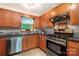 Kitchen with stainless steel appliances, light wood cabinetry, and neutral countertops at 4919 Rehobeth Rd, Waxhaw, NC 28173