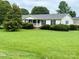 Charming single-story home with a well-manicured lawn and inviting front porch at 5816 Scotland Yard Rd, Rock Hill, SC 29732