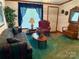 Inviting living room featuring a plush sofa, armchair, wood accents, and bright, natural light at 5816 Scotland Yard Rd, Rock Hill, SC 29732