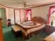 Comfortable bedroom featuring a full bed, wood furniture set, ceiling fan, and bright, natural light at 5816 Scotland Yard Rd, Rock Hill, SC 29732