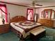 Comfortable bedroom featuring a full bed, wood furniture set, ceiling fan, and bright, natural light at 5816 Scotland Yard Rd, Rock Hill, SC 29732