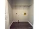 Practical laundry room with shelving, utility connections, and durable flooring at 608 E 11Th St, Newton, NC 28658