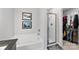 Bright bathroom featuring a soaking tub, separate shower, and convenient access to the walk-in closet at 6401 Morehead Rd, Harrisburg, NC 28075