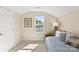 Cozy bedroom with a daybed, window with tree views, and neutral tones creating a comfortable retreat at 6401 Morehead Rd, Harrisburg, NC 28075