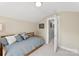 Comfortable bedroom featuring a daybed and access to the hallway, providing a calm and functional space at 6401 Morehead Rd, Harrisburg, NC 28075