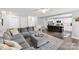 Open-concept living space connecting the living room and kitchen at 6401 Morehead Rd, Harrisburg, NC 28075
