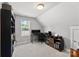 Bright office with multiple monitors, a sleek desk, and natural light from the window at 6401 Morehead Rd, Harrisburg, NC 28075