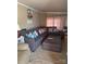 Comfortable living room featuring a large sectional sofa, an ottoman and scenic lake-themed decor at 690 Lake Head Rd # 132, Norwood, NC 28128