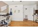 Bonus room features hardwood floors, overhead lighting, and a desk with built-in cabinets at 7107 Cedarfield Rd, Charlotte, NC 28227