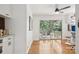 Bright bonus room includes hardwood floors, a ceiling fan, and glass patio doors to the outside deck at 7107 Cedarfield Rd, Charlotte, NC 28227