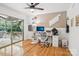 Bonus room with a ceiling fan, hardwood floors, a sliding glass door and outside deck access at 7107 Cedarfield Rd, Charlotte, NC 28227