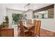 Bright dining room features wood floors, modern light fixture, and sliding glass doors to the backyard at 7107 Cedarfield Rd, Charlotte, NC 28227