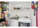 Bright laundry room with modern appliances, wire shelving, and ample storage at 7107 Cedarfield Rd, Charlotte, NC 28227