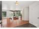 Open concept living room features hardwood floors, large windows, and natural light at 7107 Cedarfield Rd, Charlotte, NC 28227