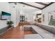 Inviting living room features open floor plan, fireplace, and comfortable sectional couch at 7107 Cedarfield Rd, Charlotte, NC 28227