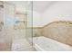 Bathroom shower with seamless glass, shower bench and tiled walls at 7107 Cedarfield Rd, Charlotte, NC 28227