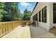 Comfortable seating arrangement on the spacious wood deck, perfect for enjoying the outdoors at 7109 Forney Hill Rd, Denver, NC 28037