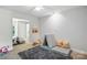 Bedroom featuring neutral carpet and an adjacent room for relaxing or playing at 7109 Forney Hill Rd, Denver, NC 28037