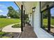 Inviting patio with brick floor, sleek pillars, and manicured landscaping at 7109 Forney Hill Rd, Denver, NC 28037