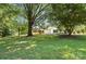 Charming home surrounded by lush greenery, featuring a spacious yard and attached garage at 7109 Forney Hill Rd, Denver, NC 28037